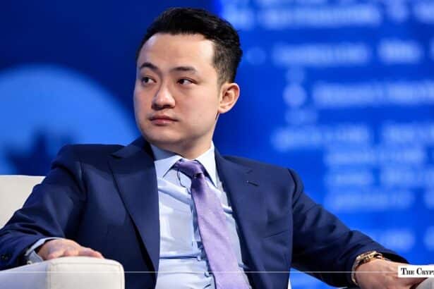 Justin Sun speaking on a stage panel.