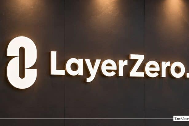 Illuminated LayerZero logo on a dark wall.
