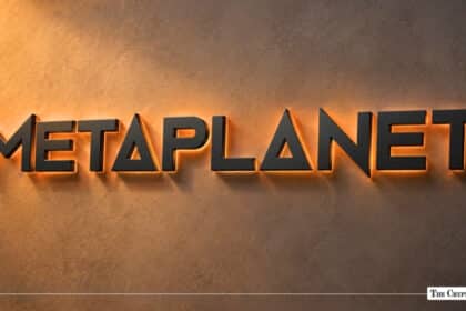 Illumination wall-mounted Metaplanet logo with warm orange backlight on textured wall