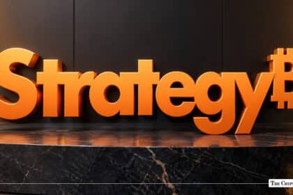 3D orange text spelling "Strategy" ending with an integrated Bitcoin symbol, set against a dark wall and marble surface.