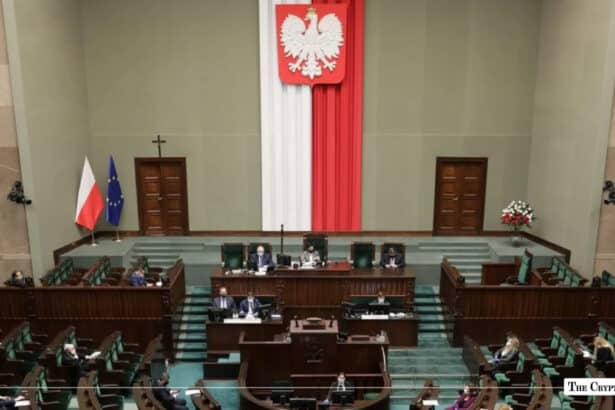 Poland's Sejm chamber in session, with lawmakers seated in green benches