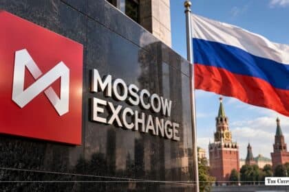 Moscow Exchange exterior sign with the Russian flag waving in front of the Kremlin towers.