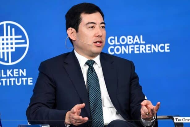 Executive speaking on a panel at the Milken Institute Global Conference.