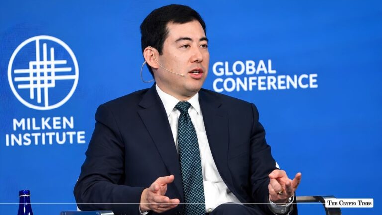 Executive speaking on a panel at the Milken Institute Global Conference.