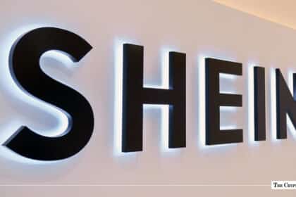 Black wall-mounted Shein signage with cool white backlight illumination