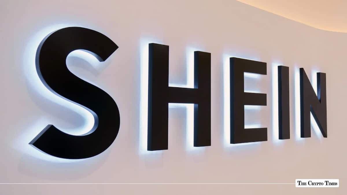 Black wall-mounted Shein signage with cool white backlight illumination