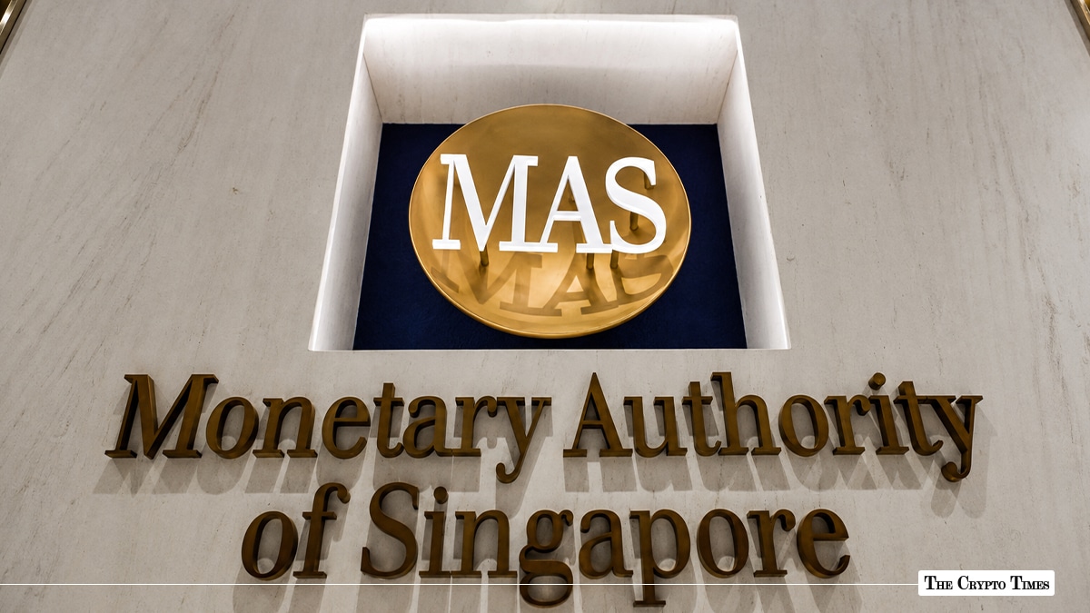 Gold-lettered building sign for the Monetary Authority of Singapore featuring the round MAS logo