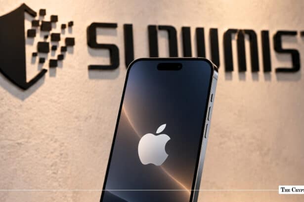 A smartphone displaying the Apple logo positioned in front of an illuminated SlowMist wall logo. JPG