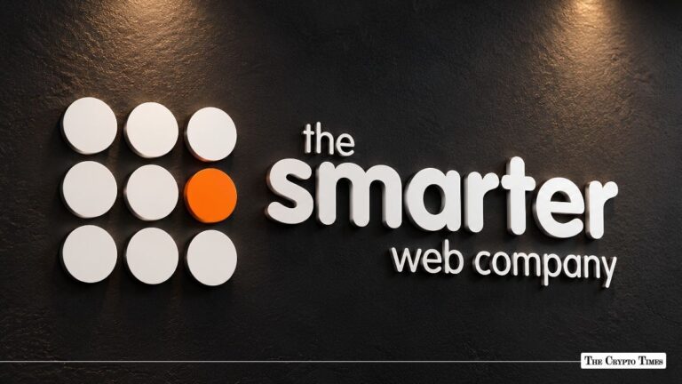 The Smarter Web Company logo mounted on a black wall.