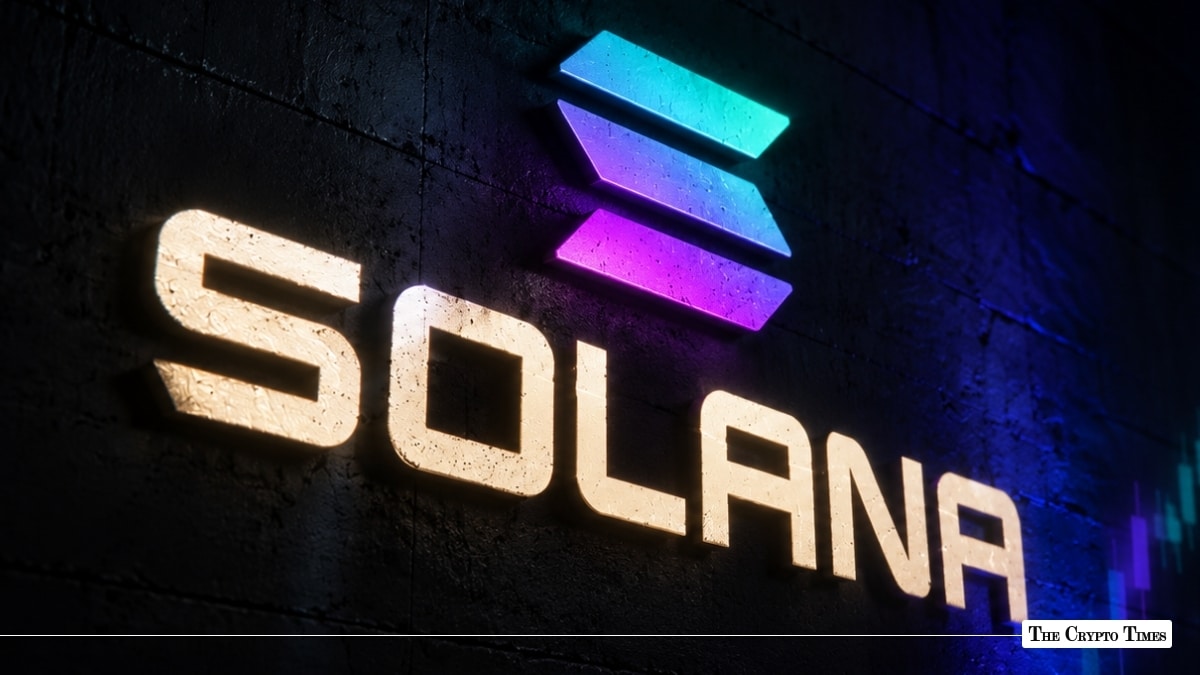 The Solana logo with its gradient icon illuminated on a dark textured wall.
