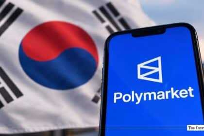 A smartphone displaying the Polymarket logo in front of the South Korean flag.