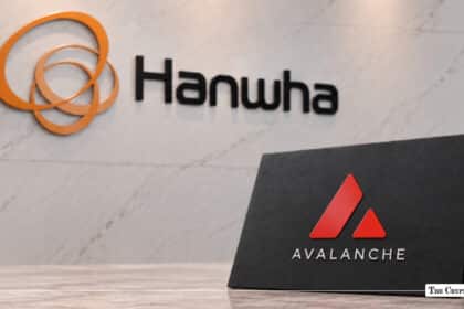 Hanwha logo mounted on a white marble wall with an Avalanche tabletop sign positioned in the foreground