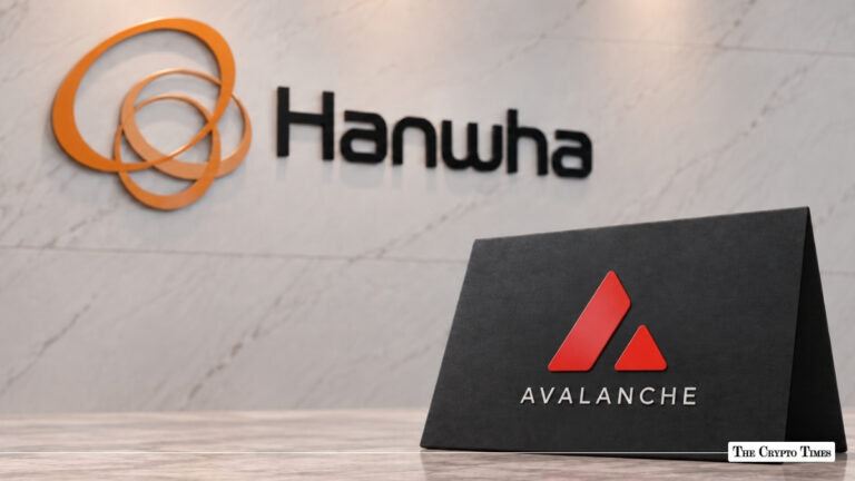 Hanwha logo mounted on a white marble wall with an Avalanche tabletop sign positioned in the foreground