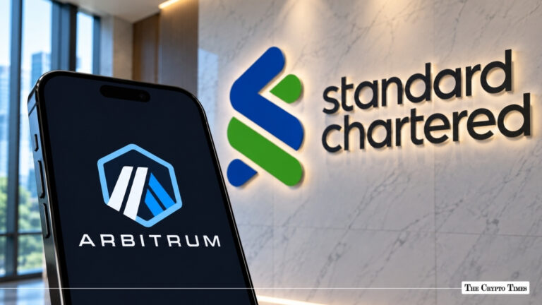 A smartphone showing the Arbitrum logo next to an illuminated Standard Chartered wall sign