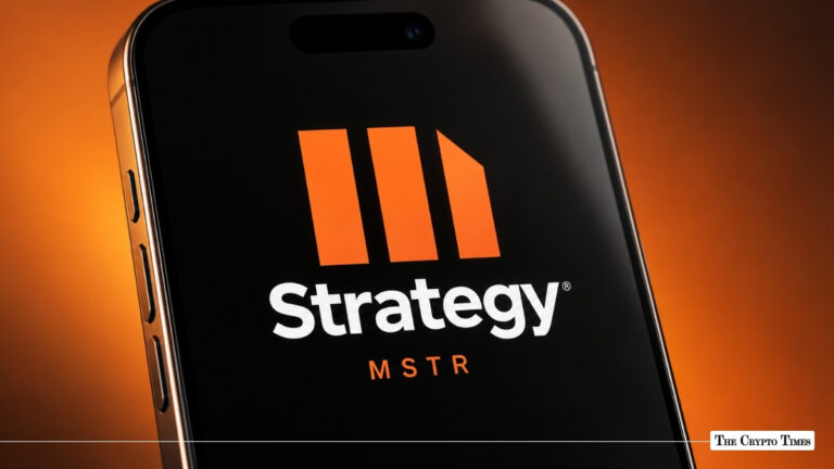 A smartphone screen showing the orange Strategy (MSTR) logo against a warm background.