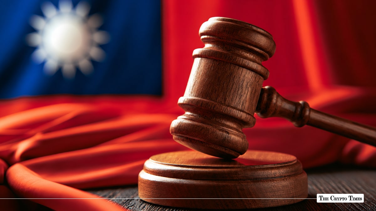 Wooden judge's gavel and sound block set against a blurred Taiwanese flag background