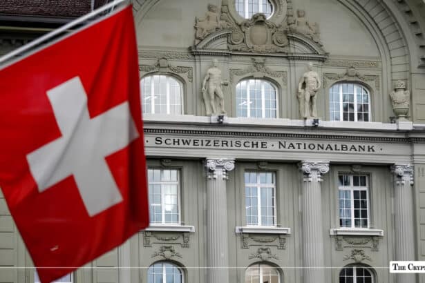 Swiss flag flying in front of the Swiss National Bank (Schweizerische Nationalbank) building