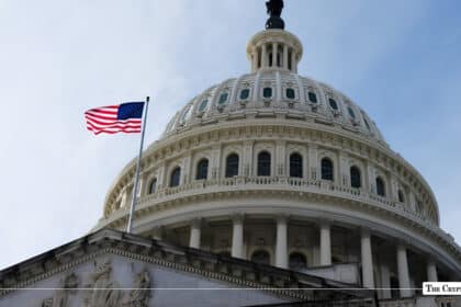 The U.S. Capitol Building with an American flag flying in front