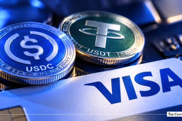 USDC and Tether USDT stablecoin coins resting on top of a Visa credit card