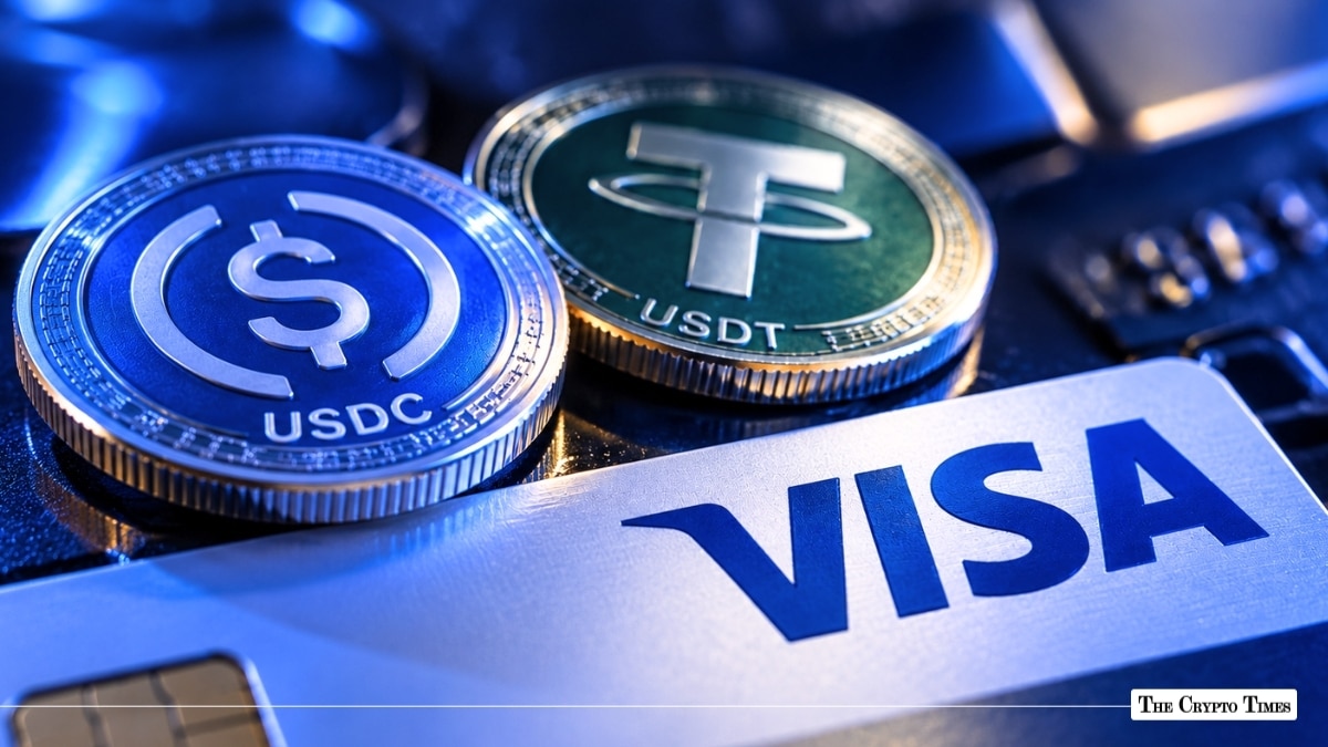 USDC and Tether USDT stablecoin coins resting on top of a Visa credit card
