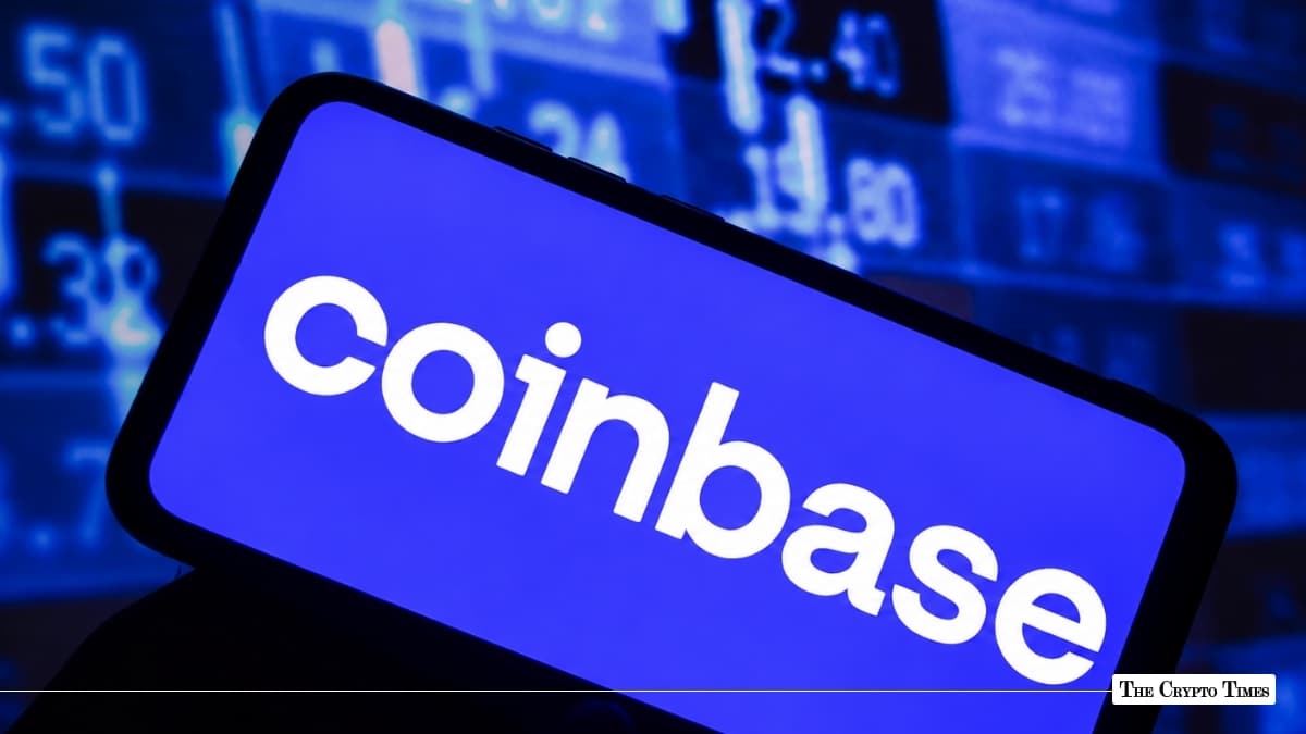 Smartphone displaying Coinbase app logo with financial stock market ticker screen in background