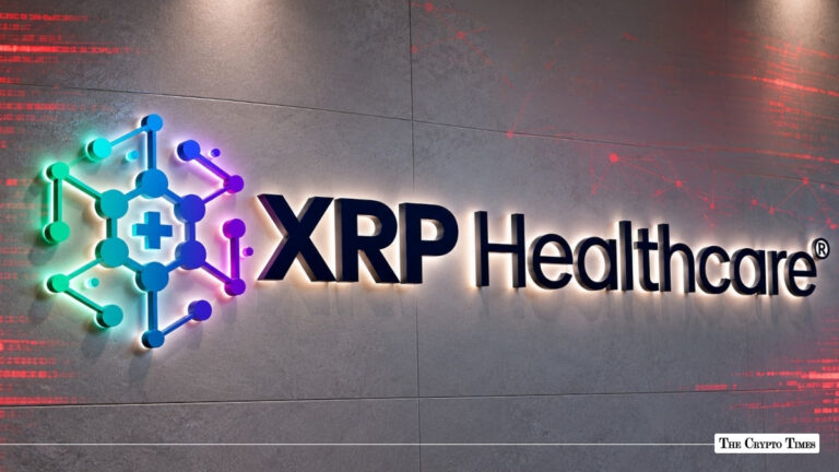 Illuminated 3D XRP Healthcare logo mounted on a concrete wall alongside a red digital network graphic overlay