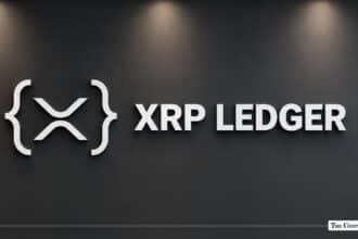 XRP Ledger corporate logo and sign mounted on a dark interior wall.