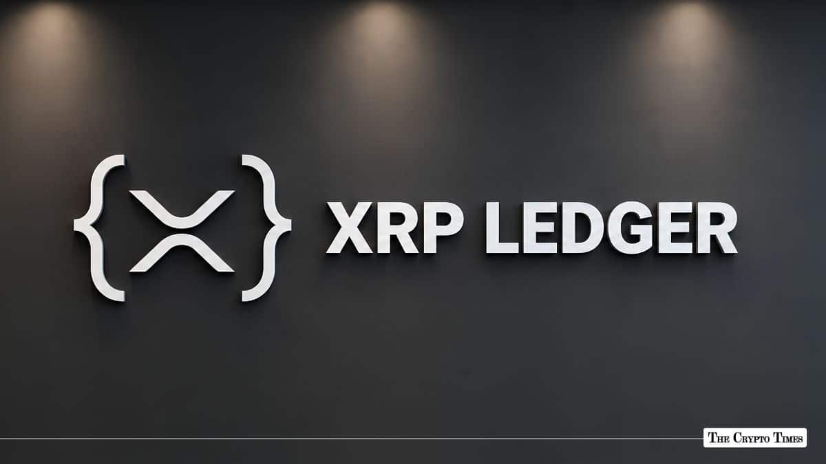XRP Ledger corporate logo and sign mounted on a dark interior wall.