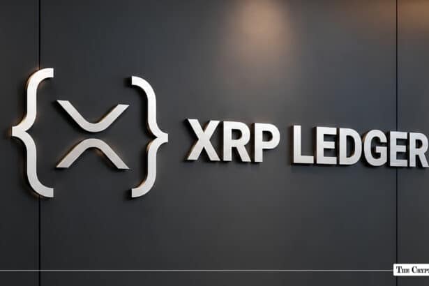 Metallic XRP Ledger logo and typography mounted on a dark office wall.