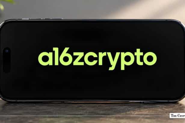Smartphone laying horizontally displaying the a16z crypto logo in green on a black screen.