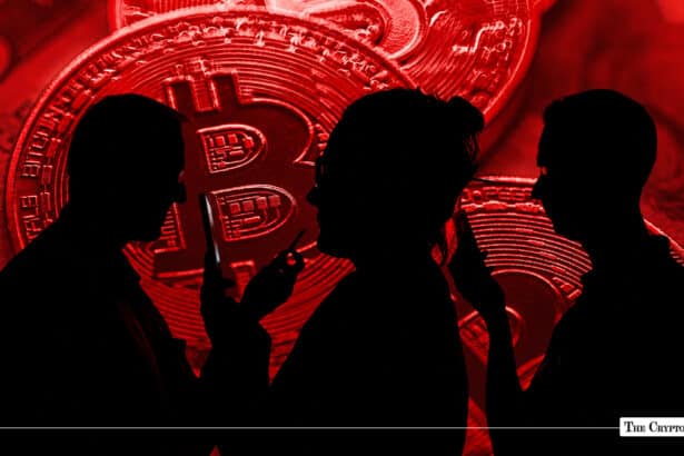 Dark red composition featuring silhouetted people holding smartphones against a backdrop of giant red physical Bitcoin coins