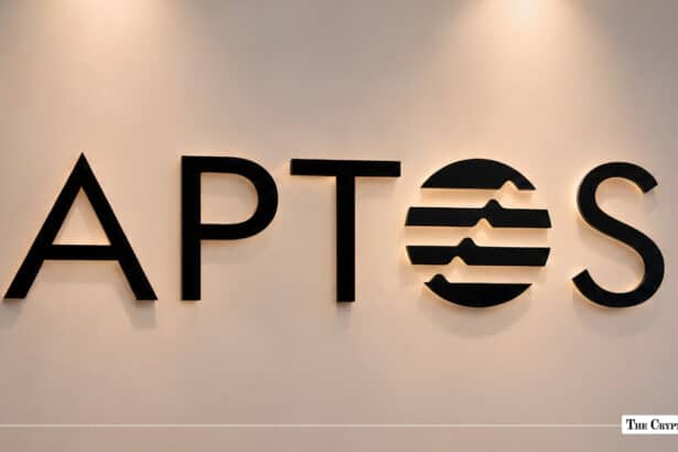 Aptos logo mounted on an illuminated indoor wall.