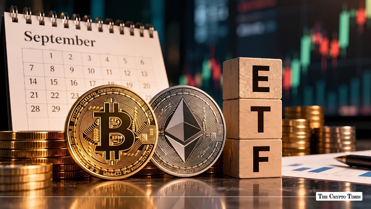 Physical Bitcoin and Ethereum coins standing next to wooden blocks spelling ETF with a September calendar in the background.