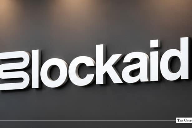 Blockaid company signage with white lettering mounted on a dark grey wall.