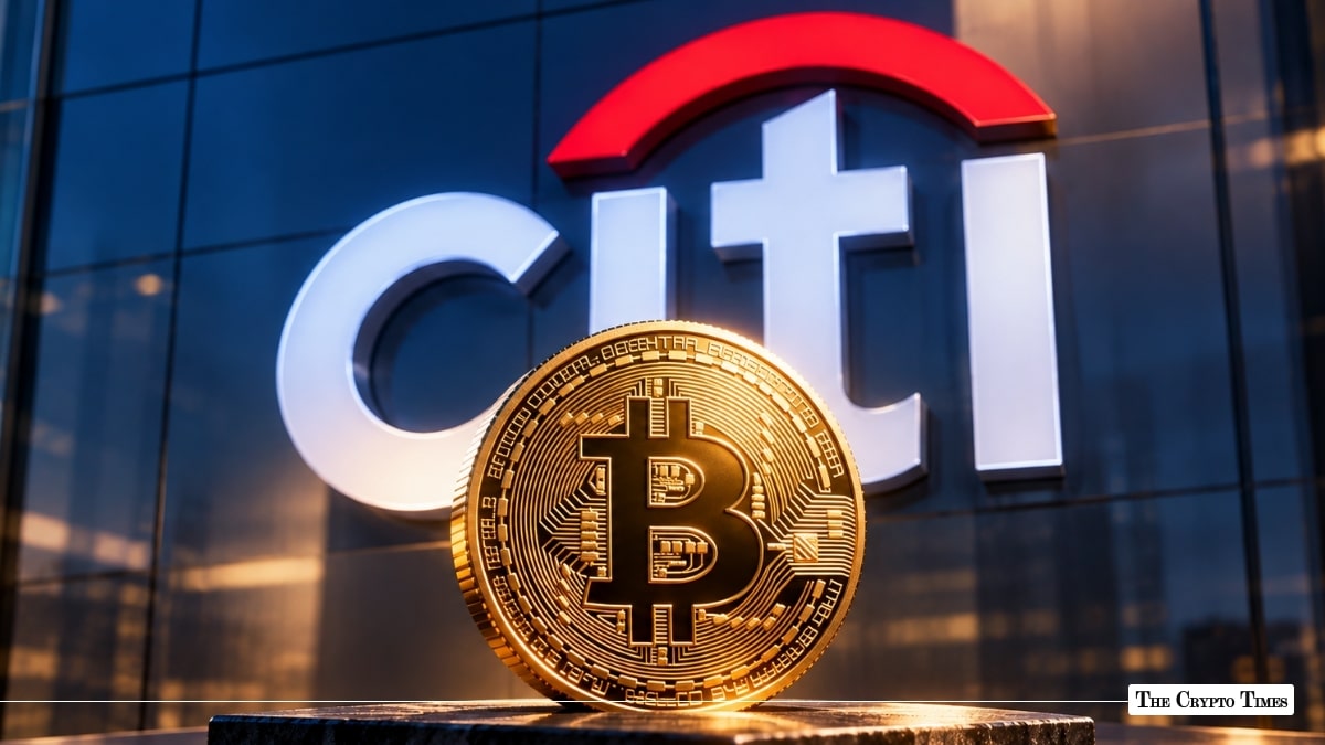 Physical gold Bitcoin coin placed in front of a giant Citi bank logo background