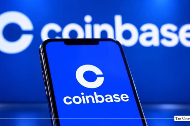 Smartphone displaying the Coinbase application logo in front of a Coinbase background.
