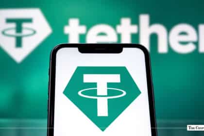 Smartphone displaying the Tether logo held in front of a green Tether screen.