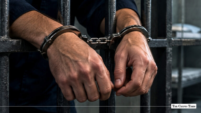 Close-up of a person's handcuffed hands resting against the dark metal bars of a jail cell