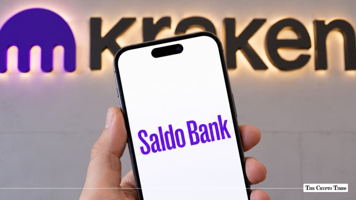 Smartphone displaying Saldo Bank logo in front of Kraken wall sign