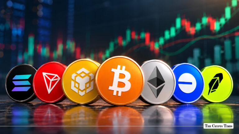 Collection of physical cryptocurrency coins arranged in a row in front of a market chart.