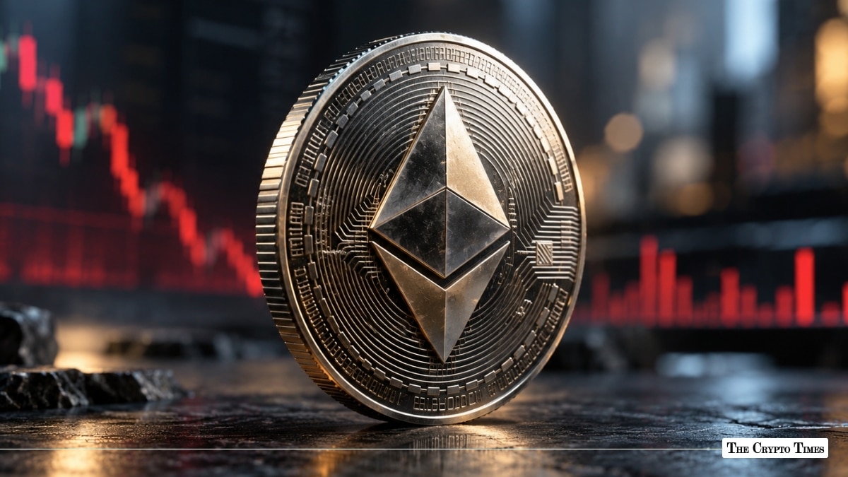 Physical silver Ethereum (ETH) token coin standing upright on a reflective dark surface in front of a red market chart