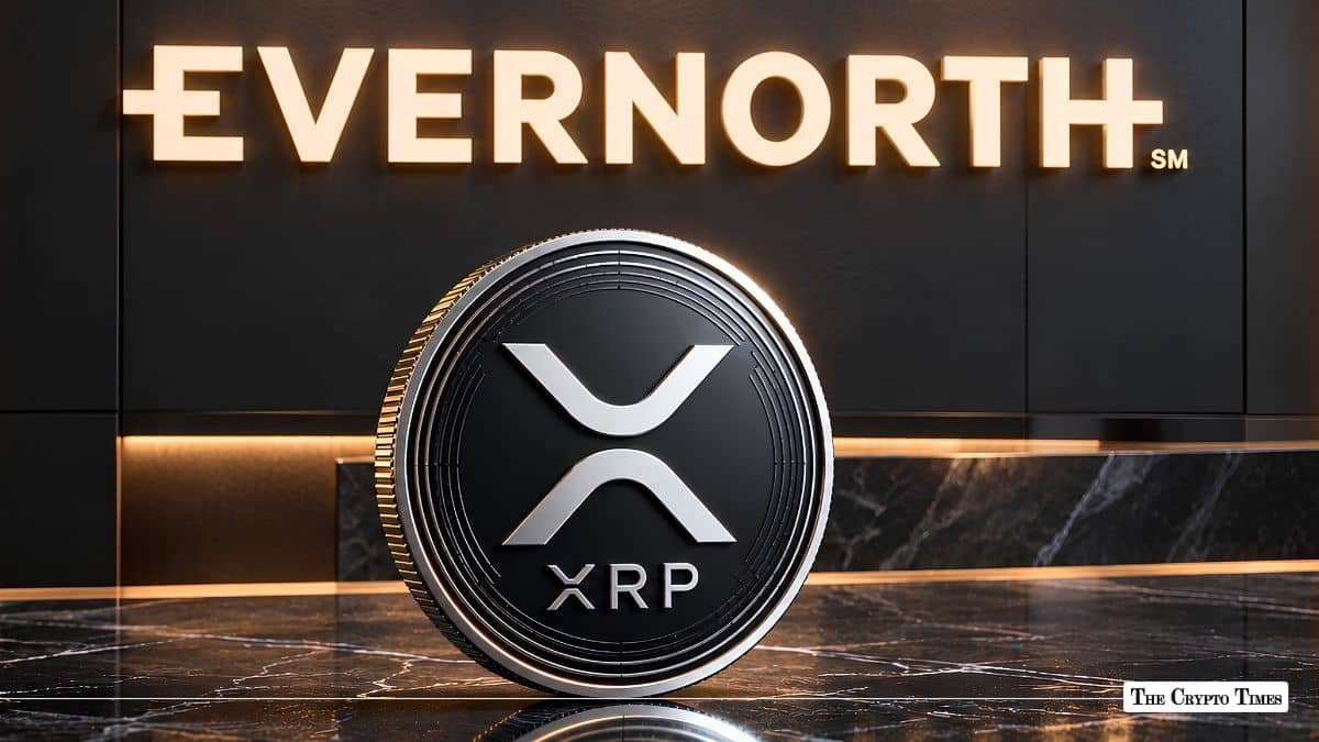 Physical XRP coin standing upright in front of an illuminated Evernorth wall sign.