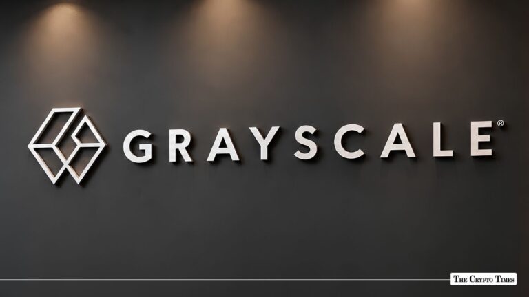 Grayscale Investments corporate logo and typography illuminated on a dark office wall.