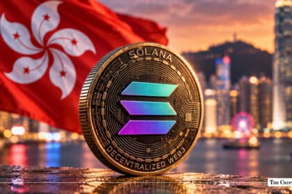 Physical Solana (SOL) coin standing upright with the Hong Kong flag and Victoria Harbour skyline in the background