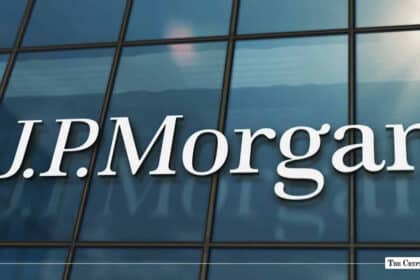 White J.P. Morgan corporate logo displayed on a glass skyscraper building facade
