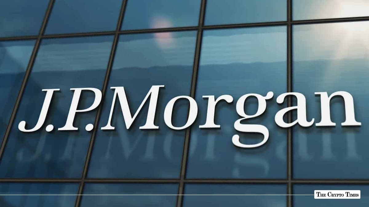 White J.P. Morgan corporate logo displayed on a glass skyscraper building facade