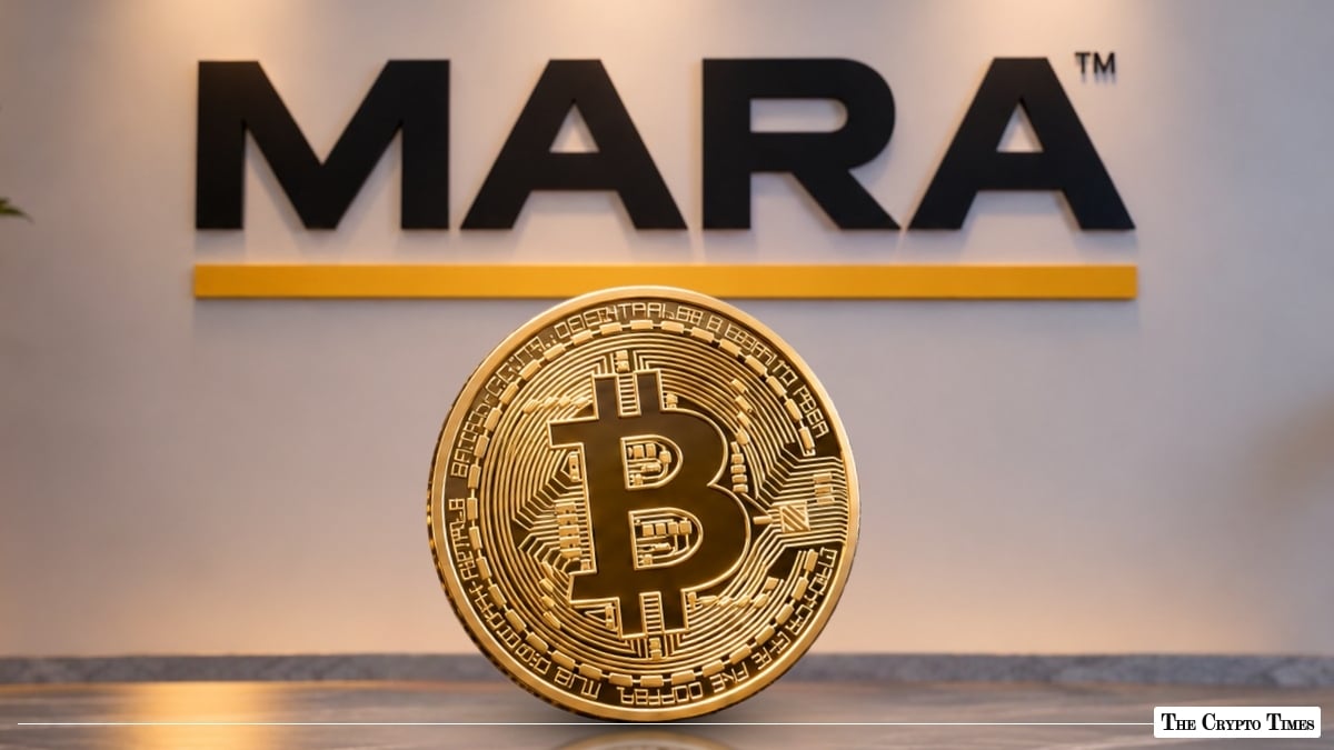 Physical gold Bitcoin coin in front of a MARA corporate logo