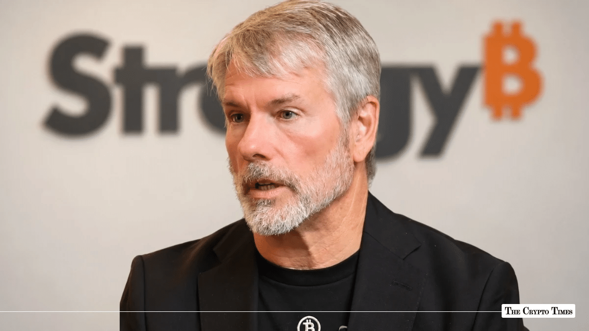 MicroStrategy Executive Chairman Michael Saylor in front of a MicroStrategy Bitcoin logo