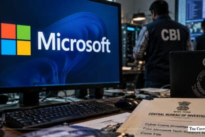 Computer monitor displaying the Microsoft logo next to a CBI Cyber Crime Investigation case file folder with CBI officers in the background
