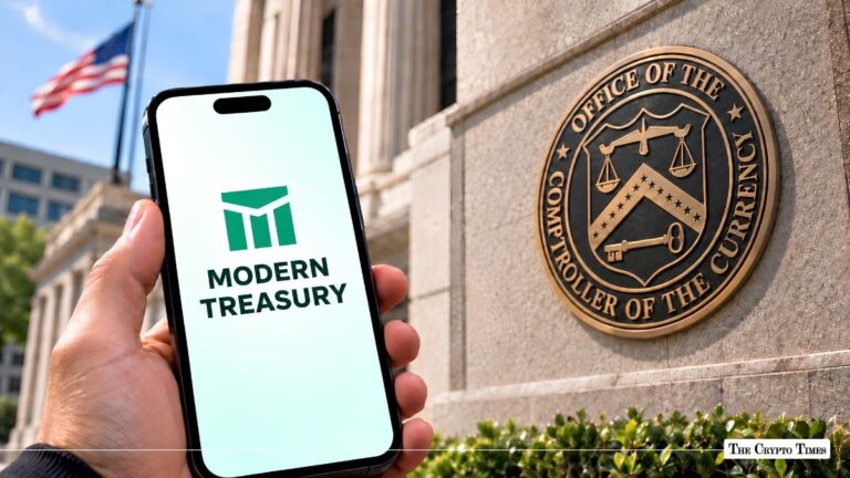 Hand holding a smartphone displaying the Modern Treasury logo in front of the OCC building seal.